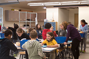 Teacher in lab with students