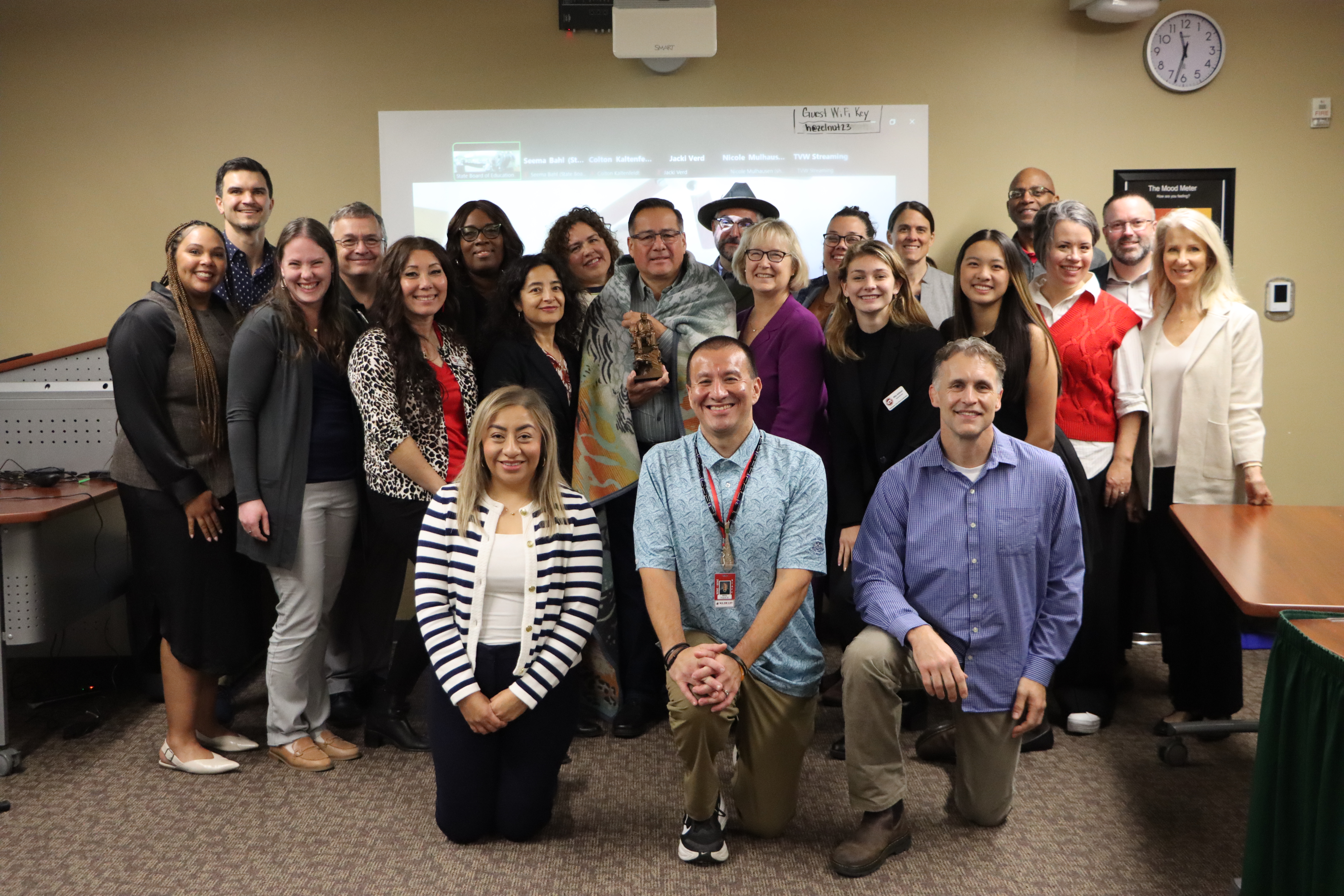 The Board and staff pose for a photo after participating in a Tribal government-to-government training led by former Board Chair Bill Kallappa II; Willie Frank III, former Chairman of the Nisqually Tribe and son of the late Billy Frank Jr.; Jerad Koepp, Native Student Program Specialist for North Thurston Public Schools and 2022 Washington State Teacher of the Year; and Corey Larson, a professor of Native American and Indigenous Studies at Evergreen State College.  