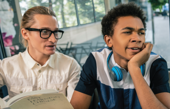 An educator works with a boy