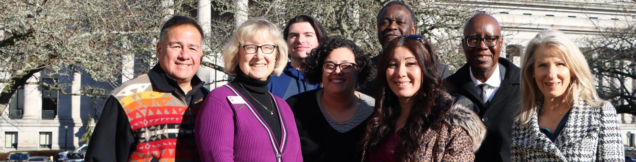 Board members pose in front of Washington State Capitol building