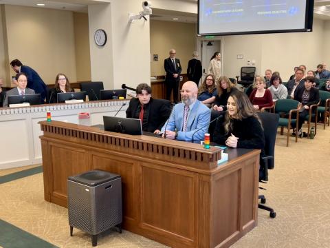 Students and staff from Quincy Innovation Academy speak with legislators during a House Education Committee work session on March 13.