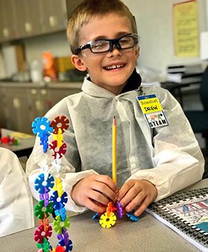 Sherman STEAM student wearing goggles in science lab